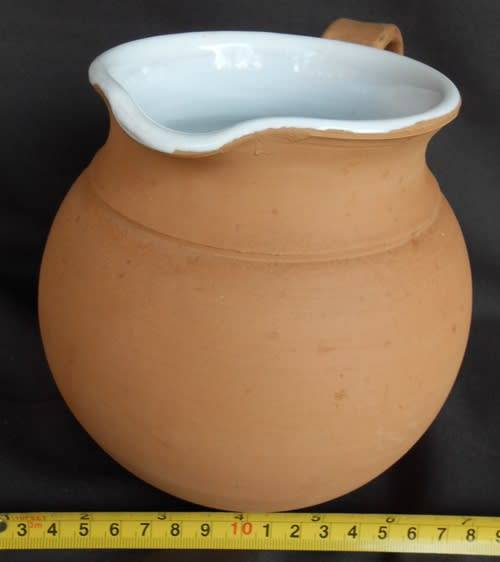 Beautiful classic shape terracotta jug with white glaze inside from Italy