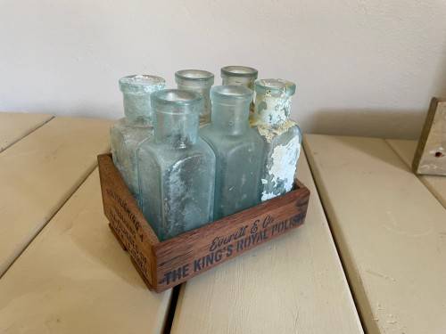 Old polish bottles in crate