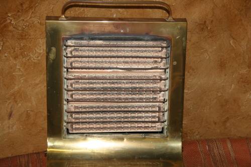 Wow a Vintage electric heater Made of brass and cast iron  Front and sides are brass Cast Iron legs