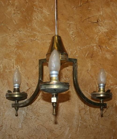 A stately three tier Vintage chandelier . The beautiful 3-light Vintage fixture is stunning working