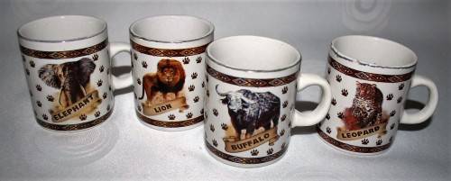 FOUR CUTE MUGS WITH PIC & DESCRIPTION ON THE BACK -  ELEPHANT, LION, BUFFALO, LEOPARD - BID PER EACH