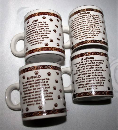 FOUR CUTE MUGS WITH PIC & DESCRIPTION ON THE BACK -  ELEPHANT, LION, BUFFALO, LEOPARD - BID PER EACH