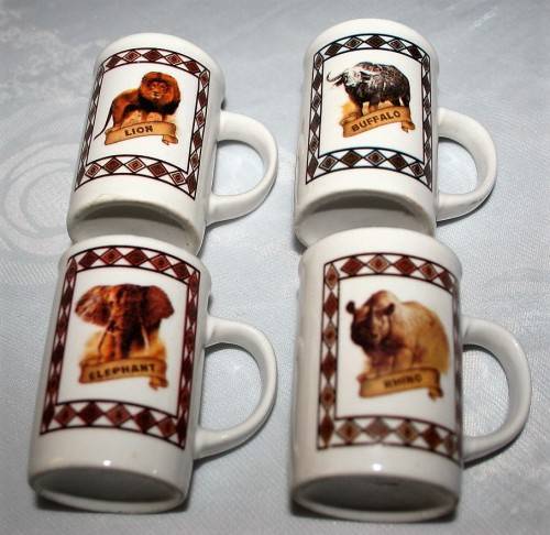 FOUR CUTE MUGS WITH PICTURES & DESCRIPTION ON BACK - * ELEPHANT, LION, BUFFALO, RHINO - BID PER EACH