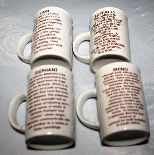 FOUR CUTE MUGS WITH PICTURES & DESCRIPTION ON BACK - * ELEPHANT, LION, BUFFALO, RHINO - BID PER EACH