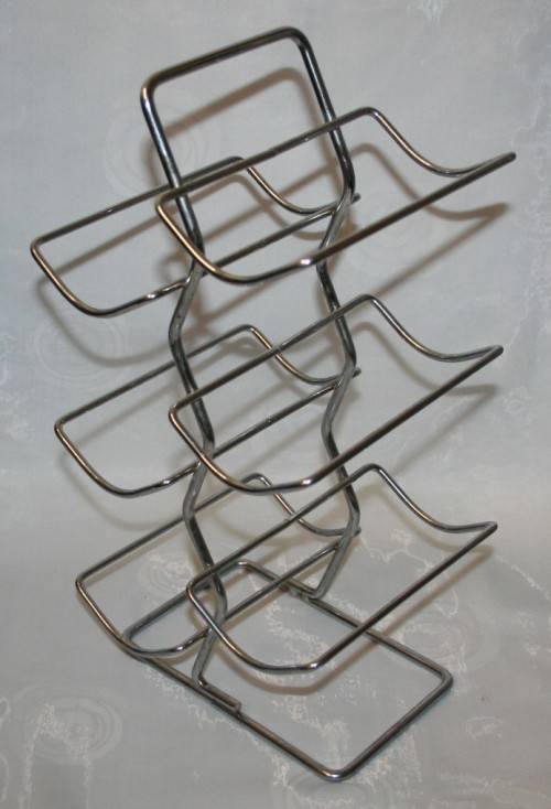 Here is a great, vintage, 5 bottle wine rack made out of Stainless steel. Stunning