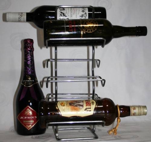 Here is a great, vintage, 5 bottle wine rack made out of Stainless steel. Stunning