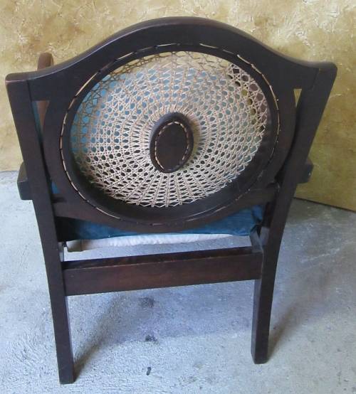A GORGEOUS SOLID IMBUIA BOW BACKED BALL & CLAW ARM CHAIR WITH A RARE WEAVED RATTAN BACK