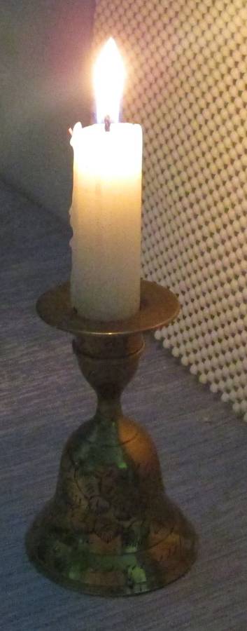 A MARVELOUS BRASS CANLE HOLDER WITH CANDLE ON TOP AND BELL ON THE BOTTOM SIDE - NO RINGER