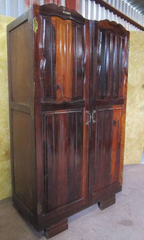 A MARVELOUS VINTAGE IMBUIA TWO DOOR WARDROBE WITH STUNNING DETAILED LEGS