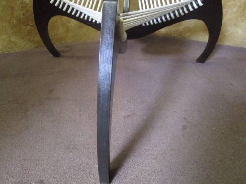 A EXQUISITE DESIGNER CHAIR WITH A DARK WOOD AND ROPE DESIGN ABSOLUTELY STUNNING