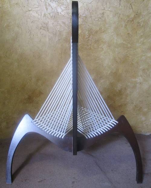 A EXQUISITE DESIGNER CHAIR WITH A DARK WOOD AND ROPE DESIGN ABSOLUTELY STUNNING