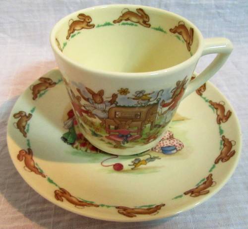 This is a "Bunnykins" child's mug and saucer set by Royal Doulton China. The set is perfect