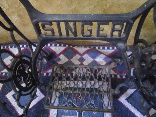 A ELEGANT ANTIQUE SINGER STAND - ADD A TOP AND USE IT FOR A BASIN STAND WILL BE A CONVERSASION PIECE