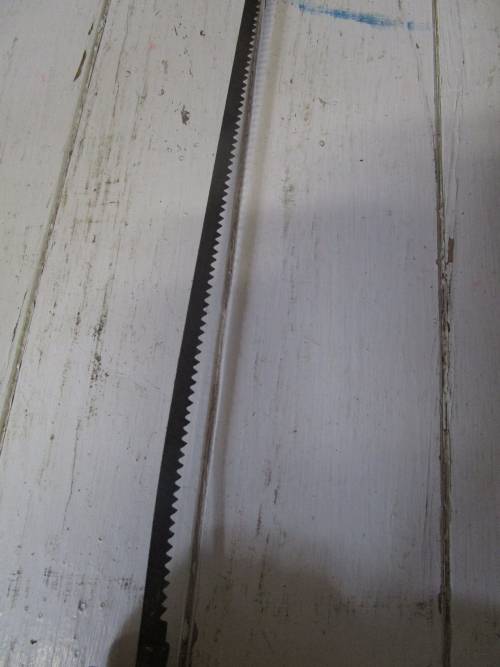 A lovely antique bow cut saw in wonderfully weathered condition with a great primitive look and feel