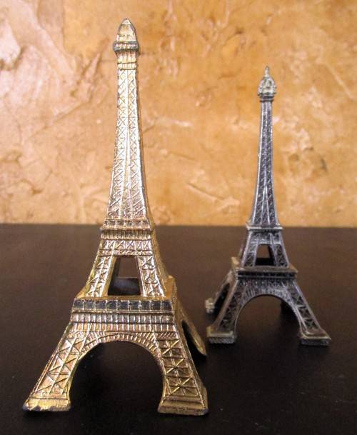 A nice pair of statues of the Eiffel Tower In Paris, originally made as visitor's souvenirs.  They l
