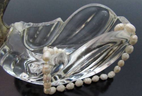 A vintage glass swan salt cellar or ring dish in good shape with a silver plated neck and head