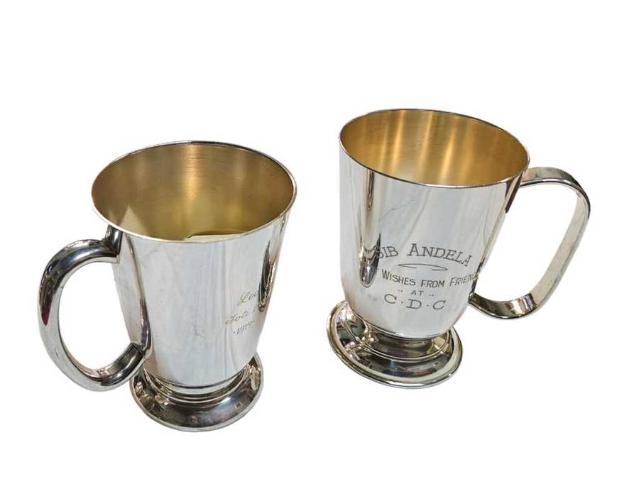 Elevate your beer drinking experience with this stunning pair of silver plated beer mugs.