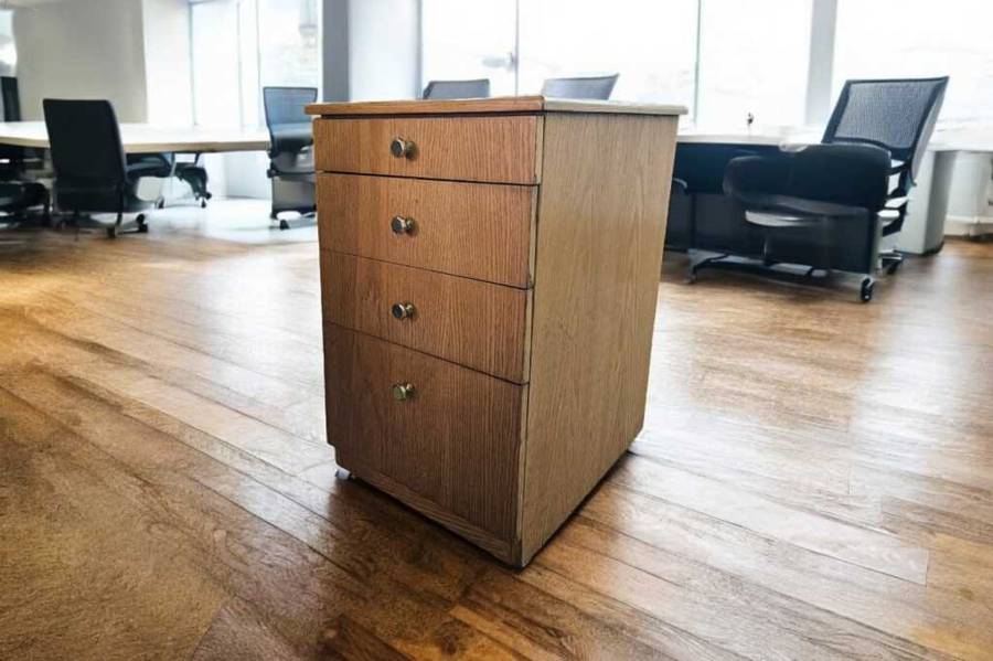 Elevate your office or bedside with this  Oak Finished set of drawers on casters,