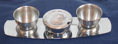 EXQUISITE  VINTAGE FOUR PIECE S STEEL SET WITH TO CUPS,  SALT POT AND SPOON DISPLAYED ON A TRAY
