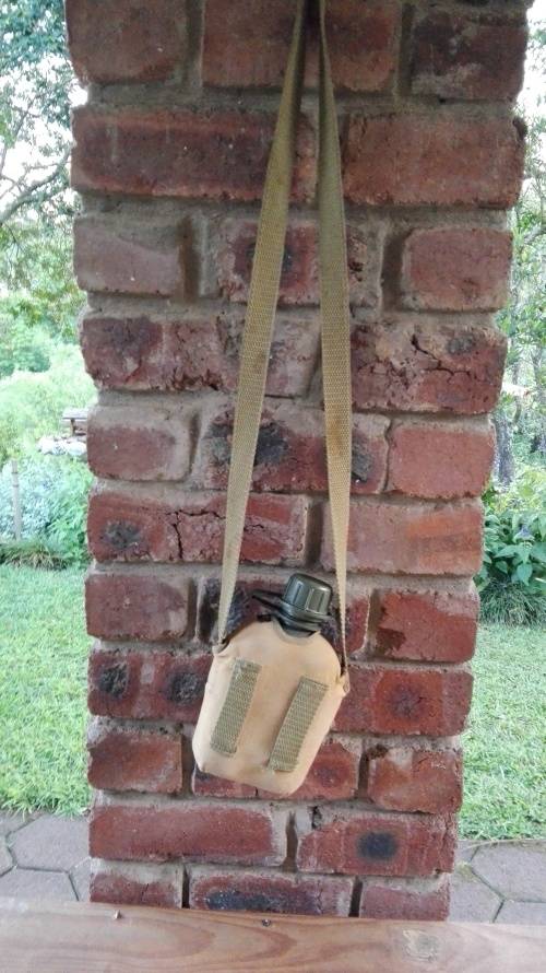 ARMY WATER BOTTLE WITH WEBBING STRAP AND WEB BELT LOOPS  (  see photographs )