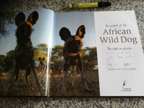 Signed by both Authors IN SEARCH OF THE AFRICAN WILD DOG ROGER and PAT DE LA HARPE  signed