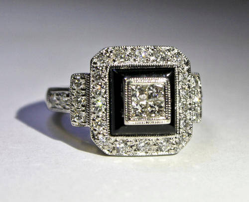 18ct White Gold Ring with Diamonds and Onyx. Valuation certificate included