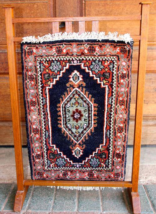 Vintage Carpet on Wooden Stand