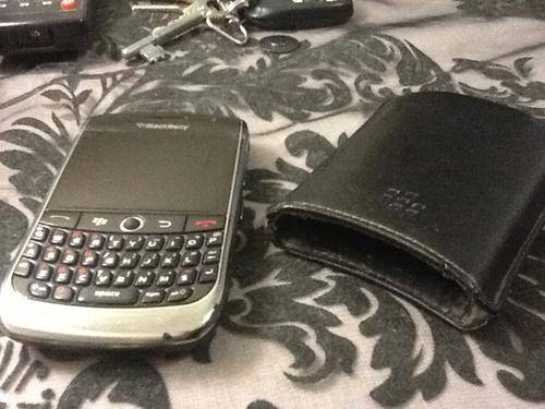 Blackberry Curve 8900 with cover and a box