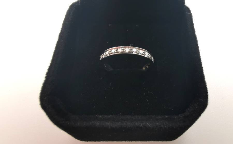 White gold and diamond half eternity ring