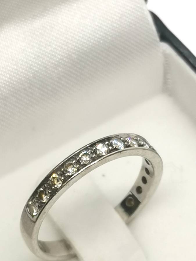 White gold and diamond half eternity ring