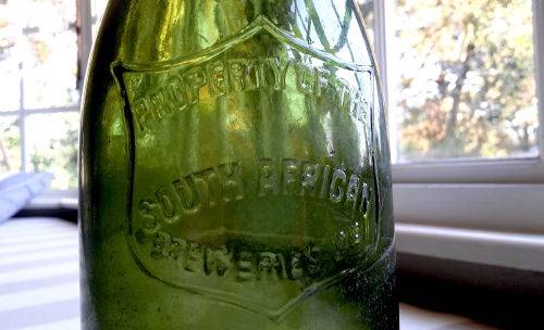 MID-YEAR SALE!!! 3 VINTAGE SAB CASTLE LAGER BEER BOTTLES WITH ORIGINAL LIDS ***VALUE R750.00***