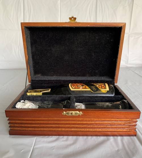 A BEAUTIFUL LINED WOODEN BOX WITH (HONEY LIQUEUR)