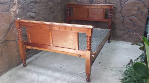 Really old, beautiful wooden double bed.