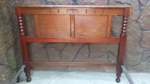 Really old, beautiful wooden double bed.