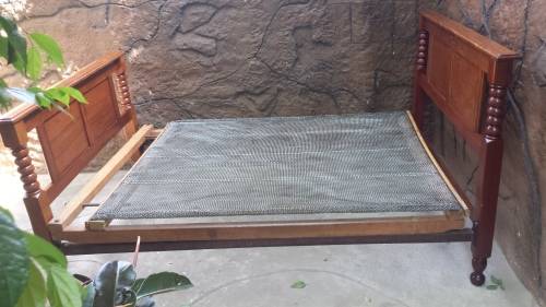 Really old, beautiful wooden double bed.