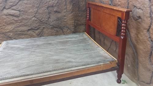 Really old, beautiful wooden double bed.
