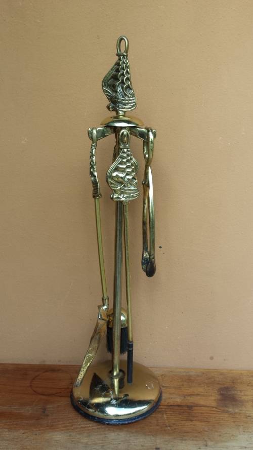 Large brass fire irons.