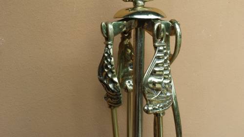 Large brass fire irons.