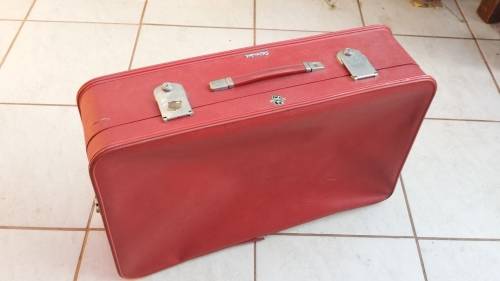 Lovely old red Revelation suitcase.