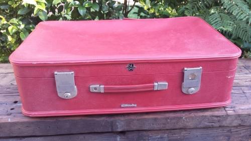 Lovely old red Revelation suitcase.