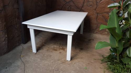 Lovely, large white, wooden table.