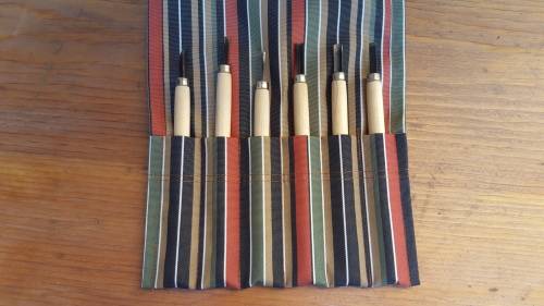 Lovely old wood carving set.