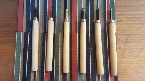 Lovely old wood carving set.