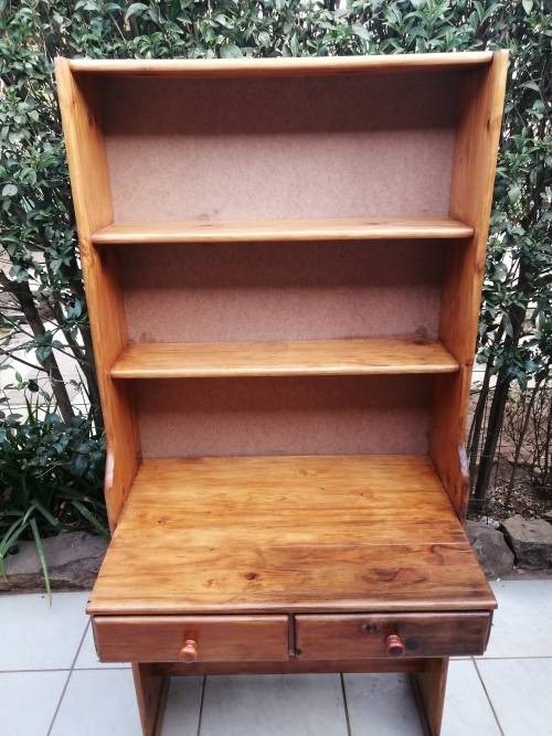 Tall, pine shelved study desk.