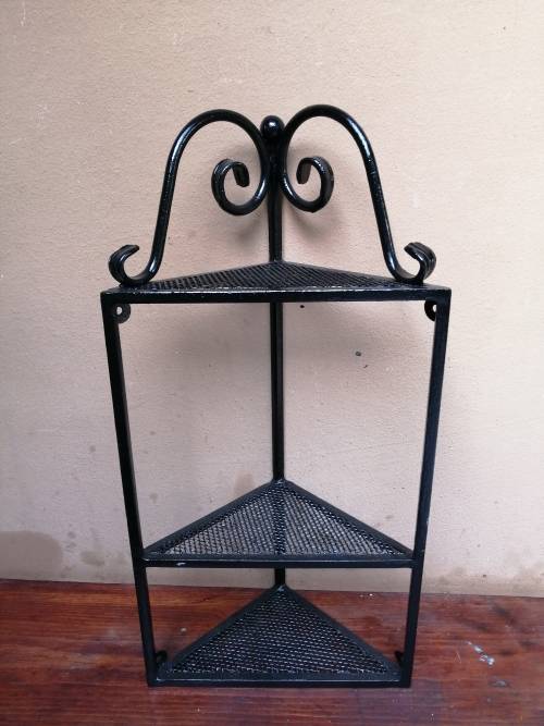 Beautiful metal wall mounted corner shelf.