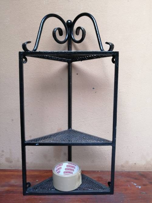 Beautiful metal wall mounted corner shelf.