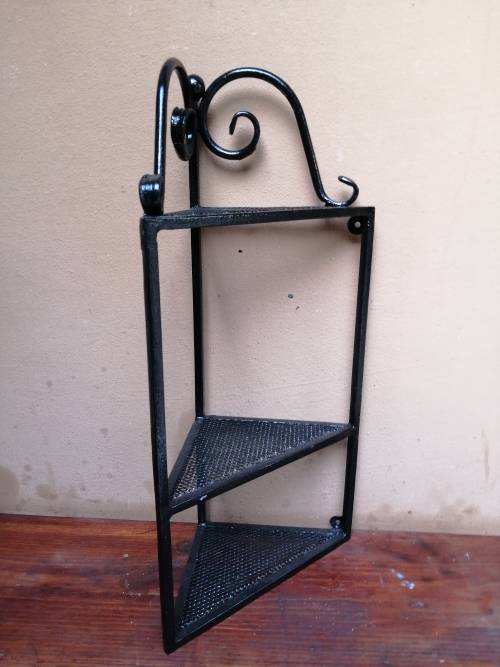 Beautiful metal wall mounted corner shelf.