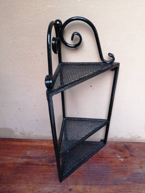 Beautiful metal wall mounted corner shelf.