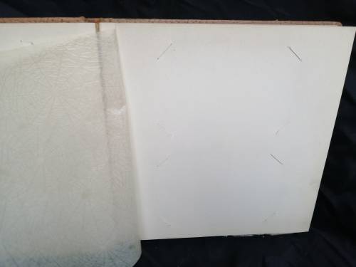 Pair of old parchment scrapbook albums.