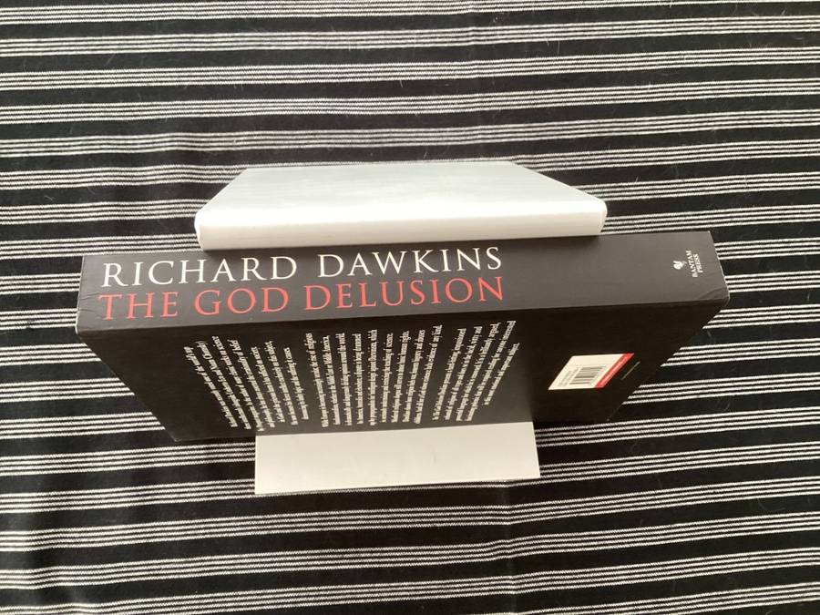 The GOD Delusion, by Richard Dawkins, Large format Paperback in a Fine Condition.